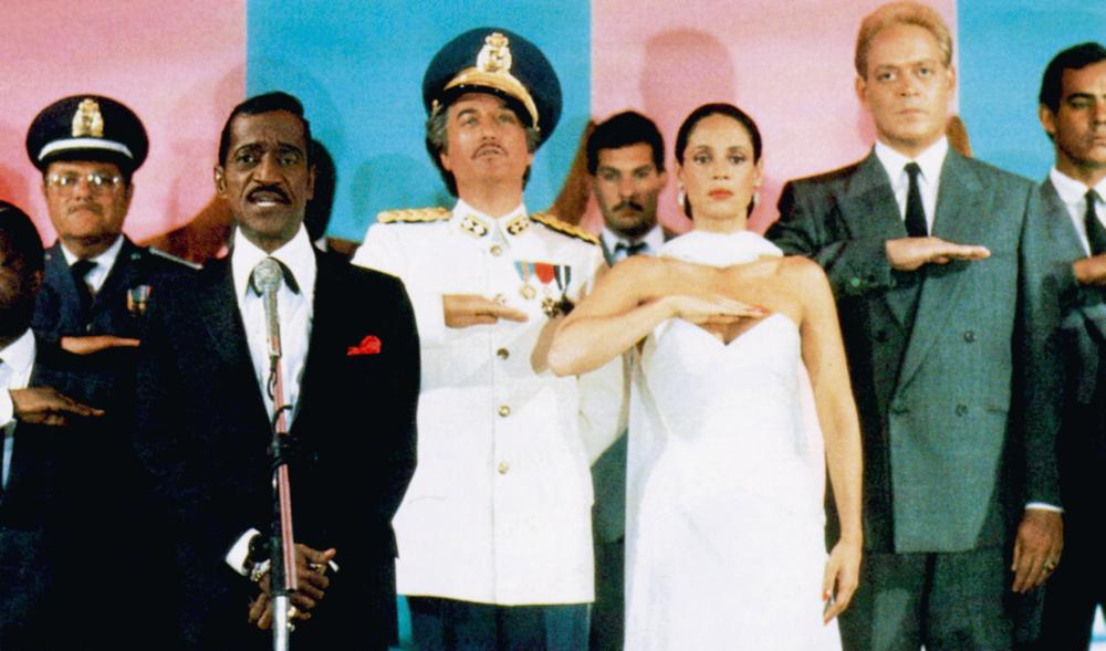 MOON OVER PARADOR, front, from left: Sammy Davis Jr., Richard Dreyfuss, Sonia Braga, Raul Julia, 1988. ©Universal Pictures/Courtesy Everett