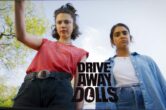 ‘Drive-Away Dolls’ Trailer: Ethan Coen’s Road Trip Comedy With Margaret Qualley & Geraldine Viswanathan Hits Theaters This September
