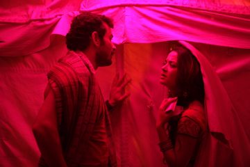 Actor CHANDAN ANAND as RAJESH & actress SURVEEN CHAWLA as BIJLI in PARCHED - Photo by Russell Carpenter, ASC - Parched