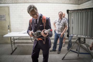 Director Paul Feig tries on the proton pack while propmaster Kirk Corwin and SFX supervisor Mark Hawker on the set of Columbia Pictures' GHOSTBUSTERS.