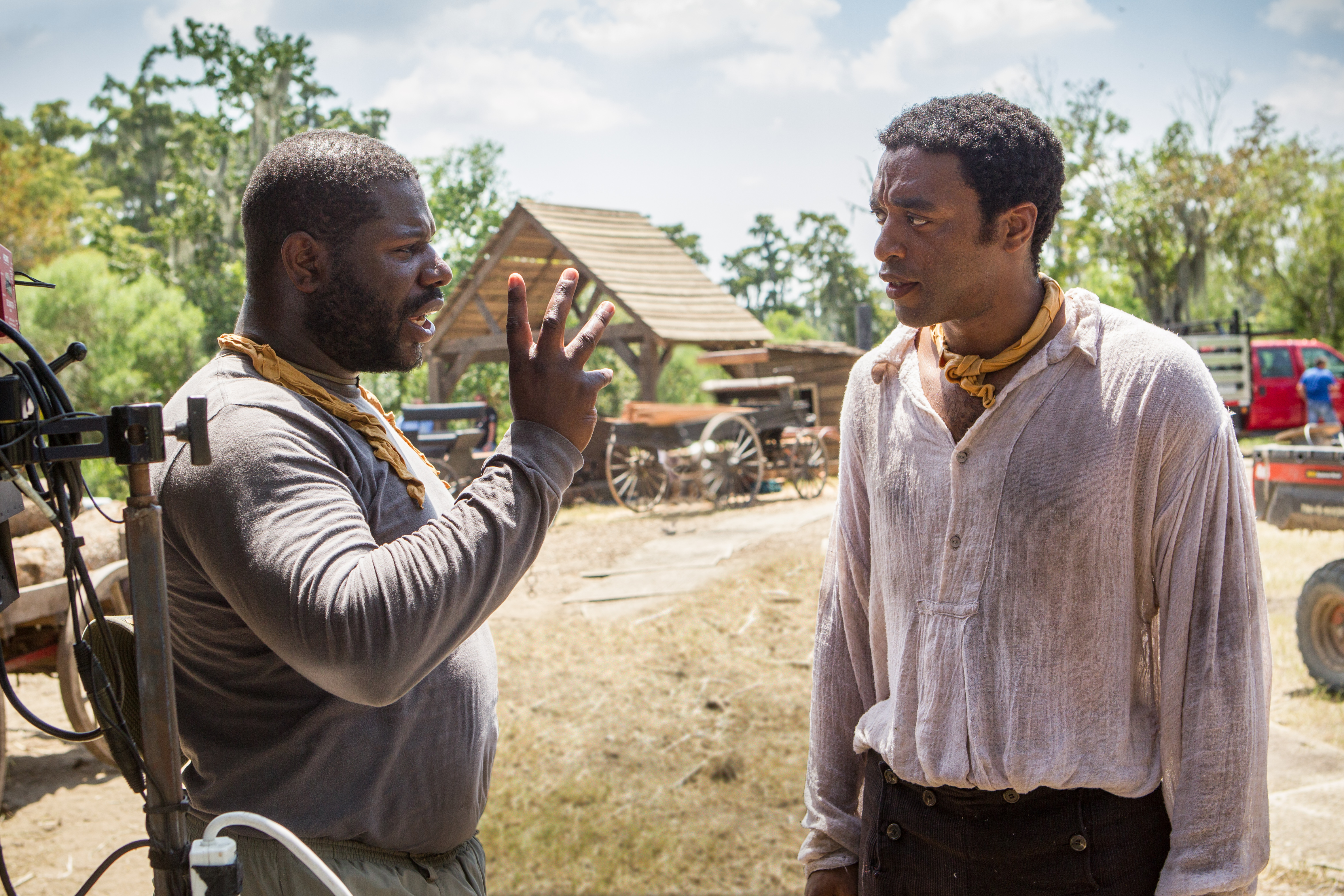 This image released by Fox Searchlight shows director Steve McQueen, left, and actor Chiwetel Ejiofor during the filming of "12 Years A Slave." (AP Photo/Fox Searchlight, Jaap Buitendijk)