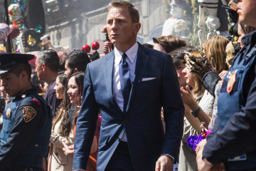 Bond (Daniel Craig) following Marco Sciarra through the Dia de los Muertos procession in Metro-Goldwyn-Mayer Pictures/Columbia Pictures/EON Productions’ action adventure SPECTRE. Tolsa Square, Mexico City.