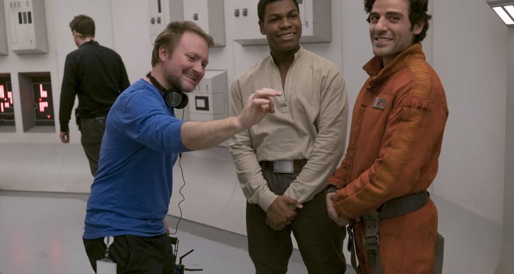 Star Wars: The Last Jedi..L to R: Director Rian Johnson on set with John Boyega (Finn) and Oscar Isaac (Poe Dameron)..Photo: David James..©2017 Lucasfilm Ltd. All Rights Reserved.