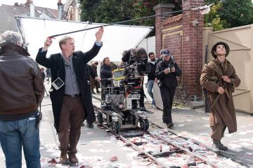 Christopher-Nolan-working-on-the-set-of-Dunkirk