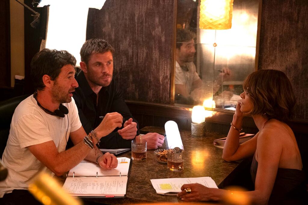 ‘Crime 101’: Chris Hemsworth, Halle Berry, & Bart Layton On Heist Films, Breaking The System, & 'Avengers: Doomsday' [The Discourse Podcast]