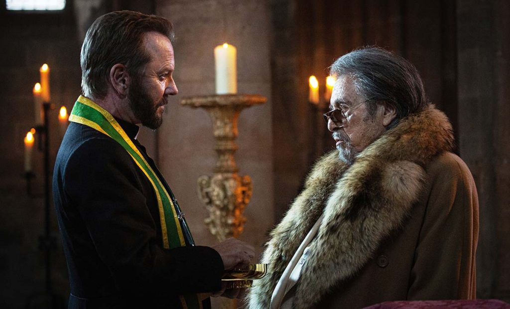 ‘Father Joe’ Review: Kiefer Sutherland’s Gunslinging Priest Shoots First, Prays Later In A Bafflingly Righteous Action Movie [Venice]